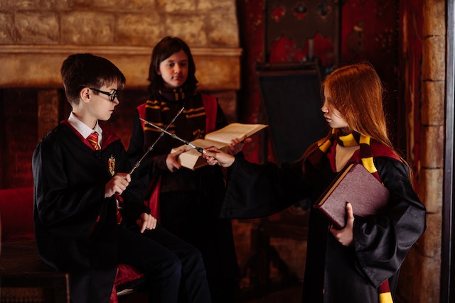 three kids are in Harry Potter costumes