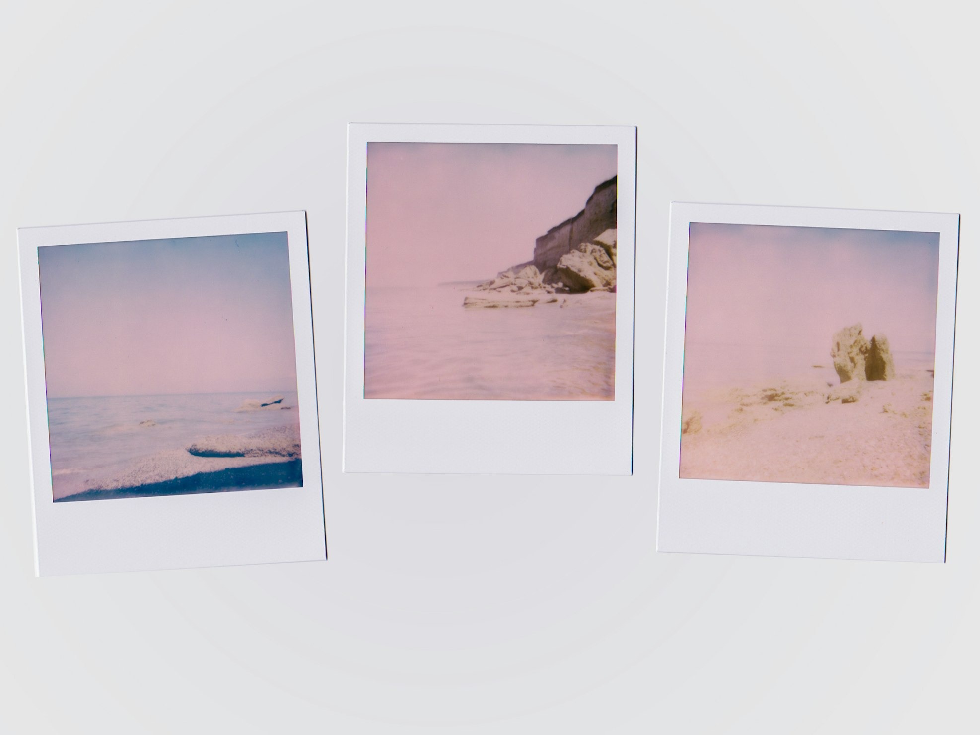 three polaroid photos on the wall