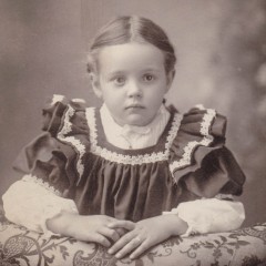 square old sepia photo of a little girl