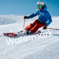 Skier in blue descending a snowy slope sample image 3