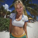 A thumbnail of a woman on the beach showing her midriff