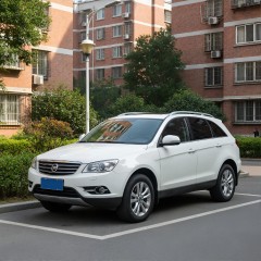 A white car in the parking lot of a residence thumbnail