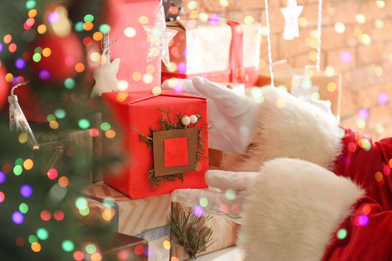 Santa Claus placing the Christmas gifts