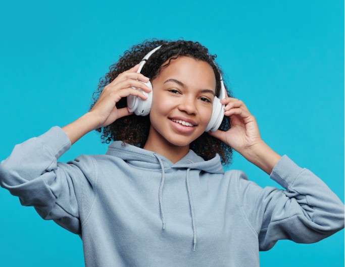 Girl holding the headphone