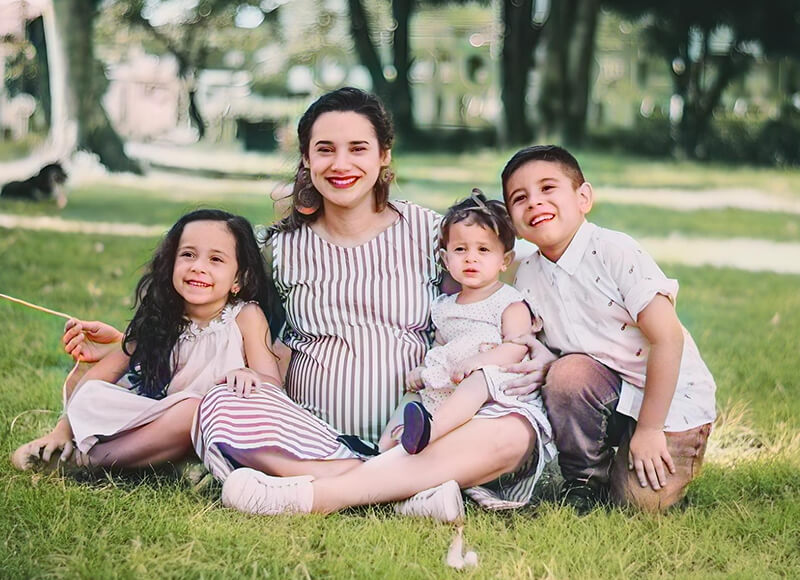A restored and colorized version of the family phot with vibrant natural colors and clear details