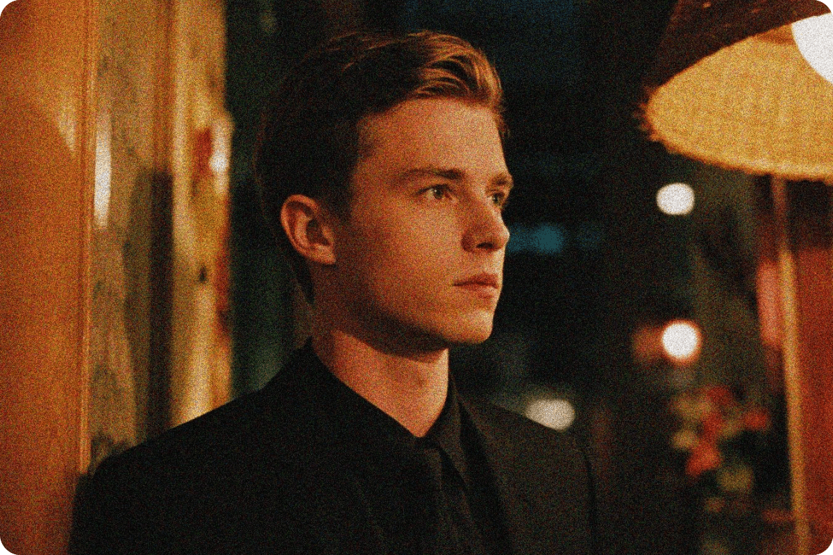 A low light photo of a handsome man with noise