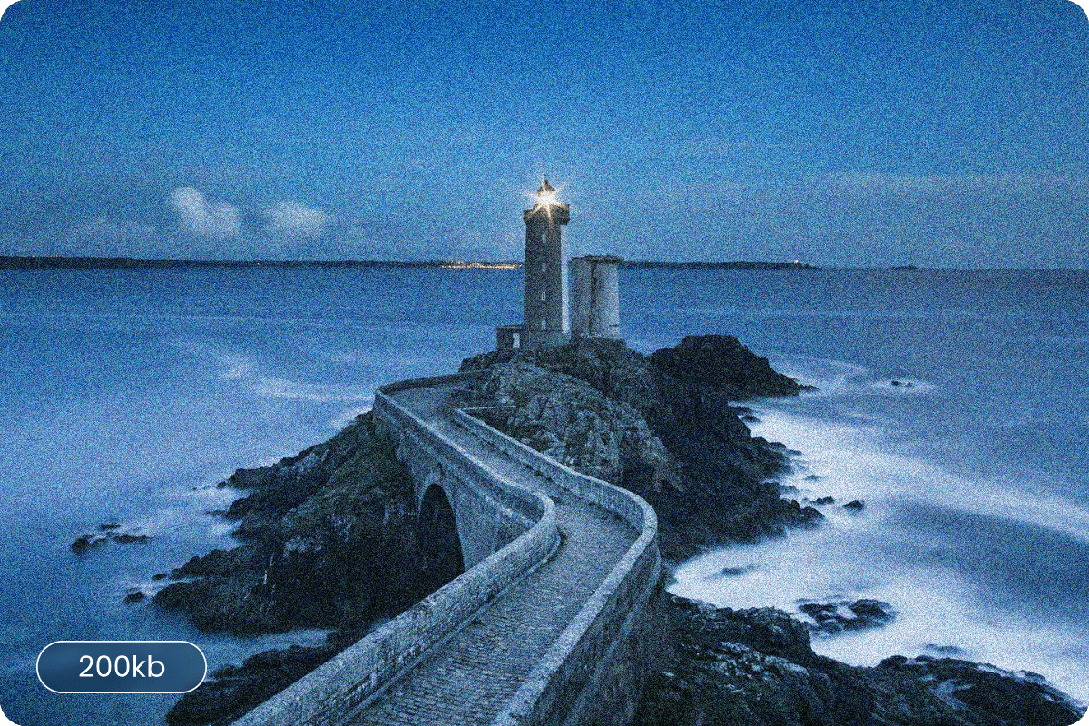 A noisy original photo of a lighthouse compressed to 200kb